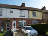 A 2 BEDROOM HOUSE WITH A LARGE ATTIC ROOM IN AXMINSTER WITH GARAGE AND PARKING
