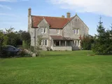 A beautiful five bedroom farmhouse located in the hamlet of Lottisham has  a  quarter acre garden and a three acre meado